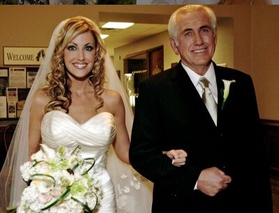 Stephanie Hollman while walking down aisle