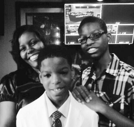 Avery Dixon with his mother and brother