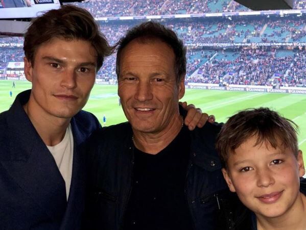 Oliver Cheshire with his father and brother