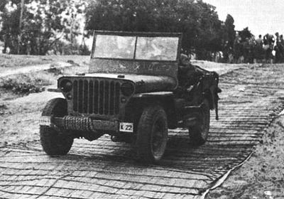 JEEP HEADED INLAND OVER STEEL MATTING NEAR LES ANDALOUSES