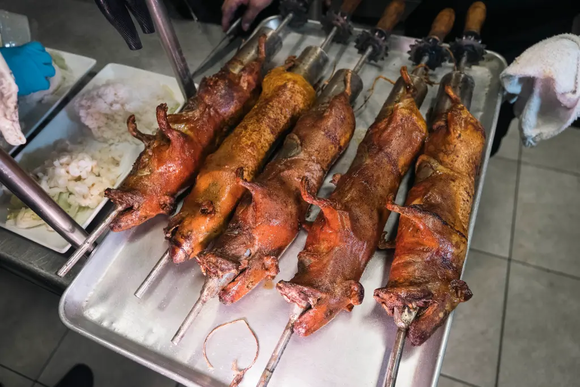 cuy-asado-grilled-giant-guinea-93086690