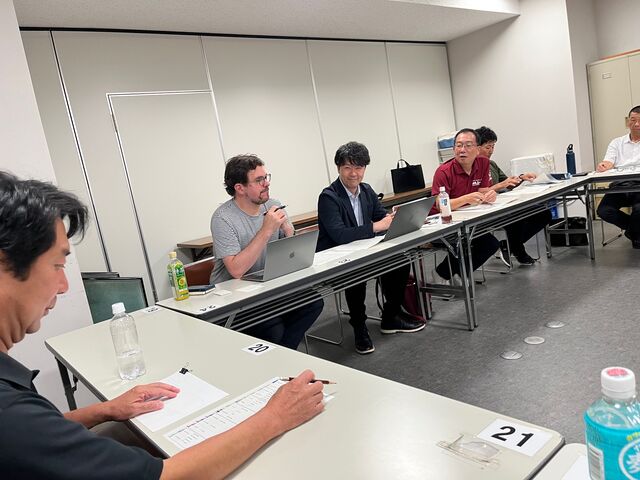 写真11 意見交換会開会