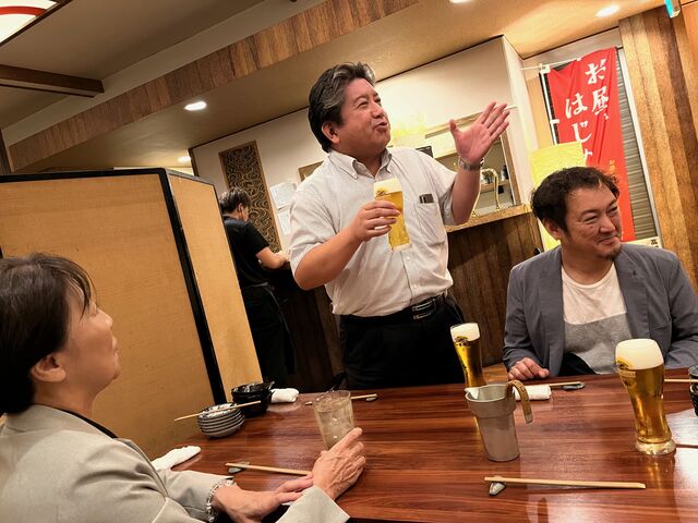 写真20 懇親会明神委員長挨拶