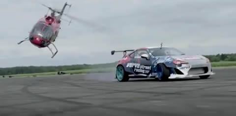Aerobatic_Helicopter_Chases_Drifting_RaceCar