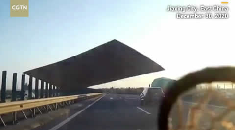 Plank smashes car windscreen after flying off truck