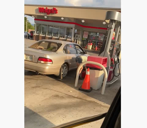 Woman Has Inefficient Way to Get Gas