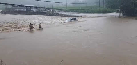 Stranded Car Sent Down Stream