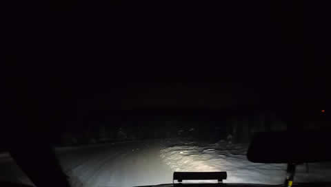 Car Drifting Corners in Snow Storm Runs off Road