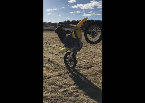 Motorcyclist Attempts Wheelie and Flies Forward