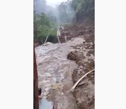 Train Crosses Risky Rails in the Rain