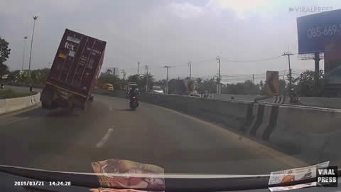 Motorbike Rider Almost Crushed By Shipping Container