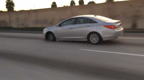 Speeding Car Is Missing A Tire