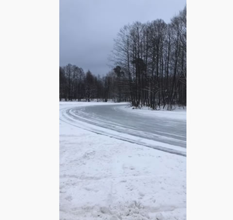 Group of Cars Slide Around Icy Corner