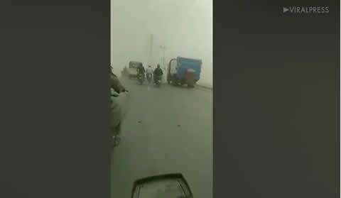 Motorcyclist Rides Through Dust Storm In Pakistan